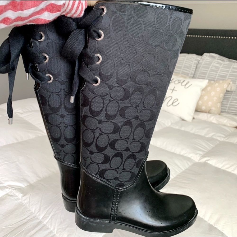 Black Coach women’s lace up rain boots